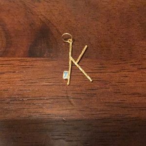 Delicate “K” pendant